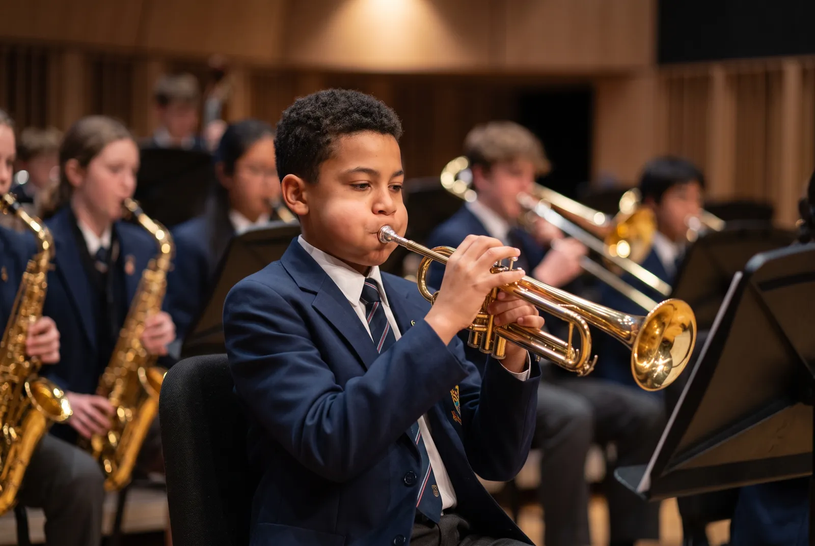 A student playing trumpet in the concert band