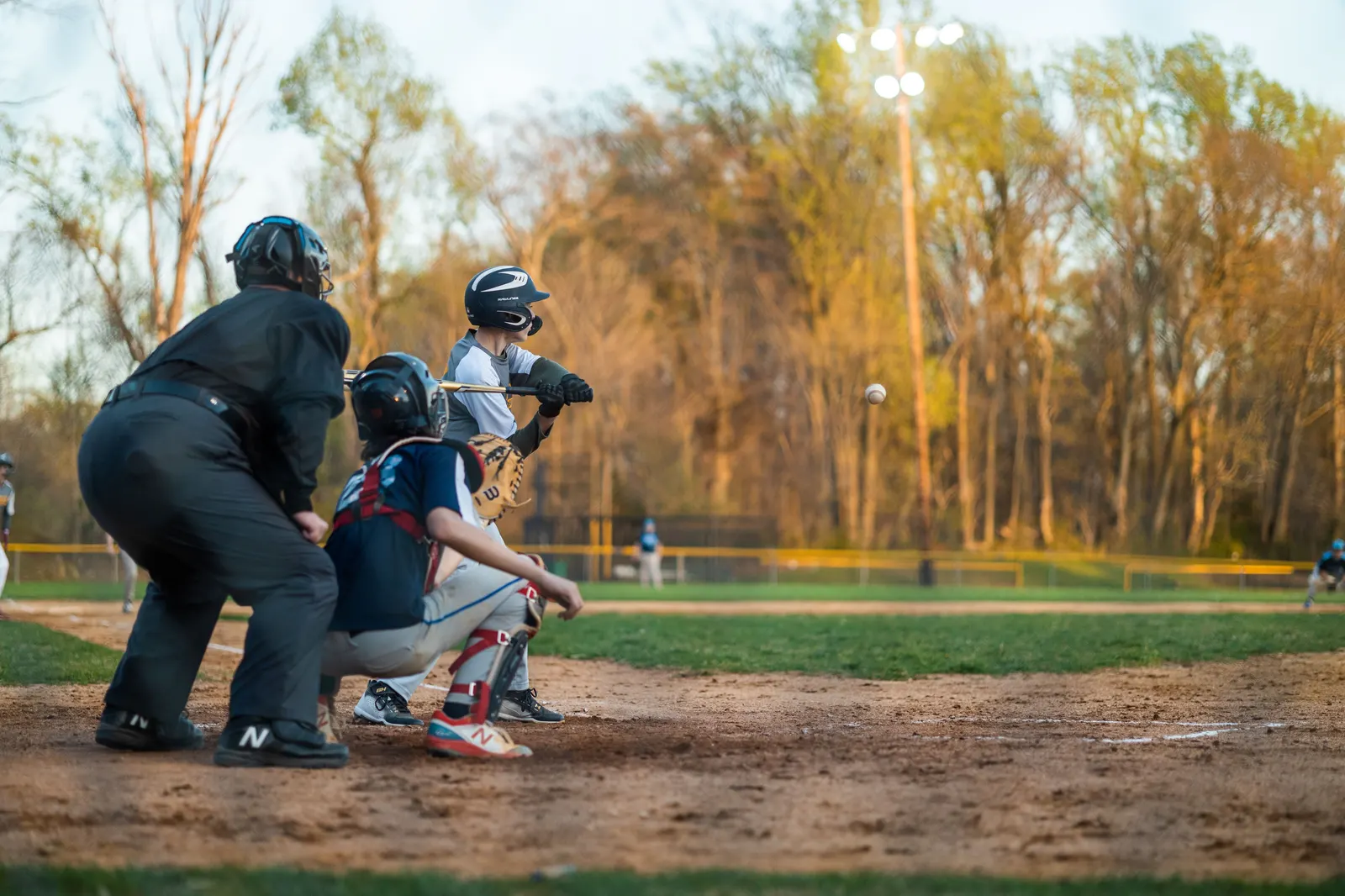 A student at bat during a baseball game