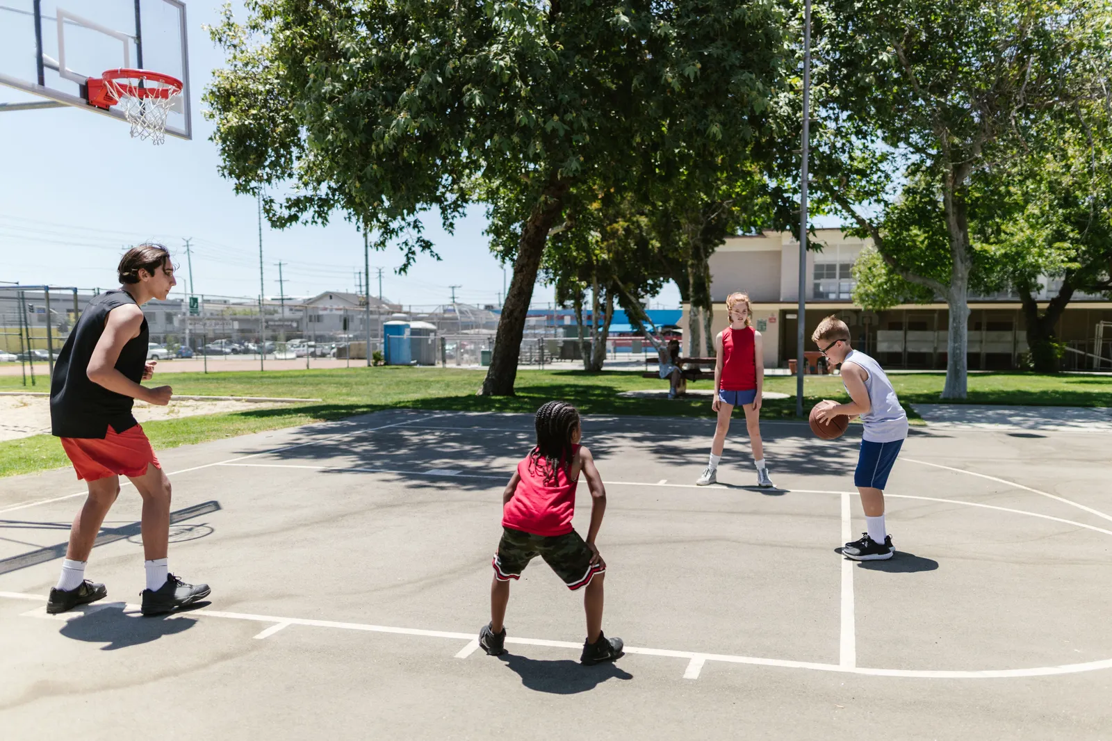 Students playing basketball on the court